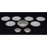 A quantity of Continental creamware chestnut baskets, plates and dishes with reticulated detail.