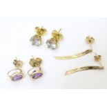 Three pairs 9ct gold earrings, to include a pair set with amethyst, etc. (3 pairs) Please Note -