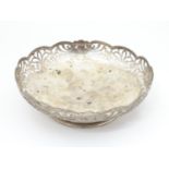 A silver dish with fretwork decoration hallmarked Birmingham 1944 maker Lanson Ltd . 6 1/2" diameter