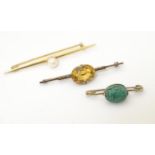 Three various gilt metal bar brooches, to include one set with central citrine and one with scarab