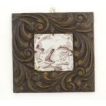 A Continental hand painted tile depicting Jonah being cast up by the whale upon the shore of