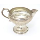 An American sterling silver pedestal cream jug. Maker F.B. Rogers Silver Co. of Taunton, Mass.