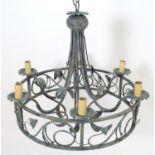 A 20thC pendant ceiling light, the circular frame supporting six lamps, with ivy and lily leaf
