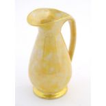 A Govancroft Glasgow pottery jug with yellow spongeware decoration. Approx. 9" high Please Note - we