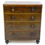 A Victorian mahogany and pine chest of drawers with a rectangular top above two over three drawers