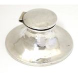 A silver inkwell of capstan form hallmarked Birmingham 1910, maker Henry Matthews. Approx. 3 1/2"