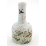 A Chinese bottle vase decorated with a landscape scene with ducks / birds. Character marks under.
