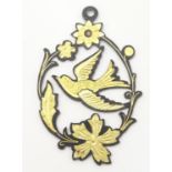 A sweetheart pendant with fretwork detail depicting swallow amongst foliage. Approx. 2" long
