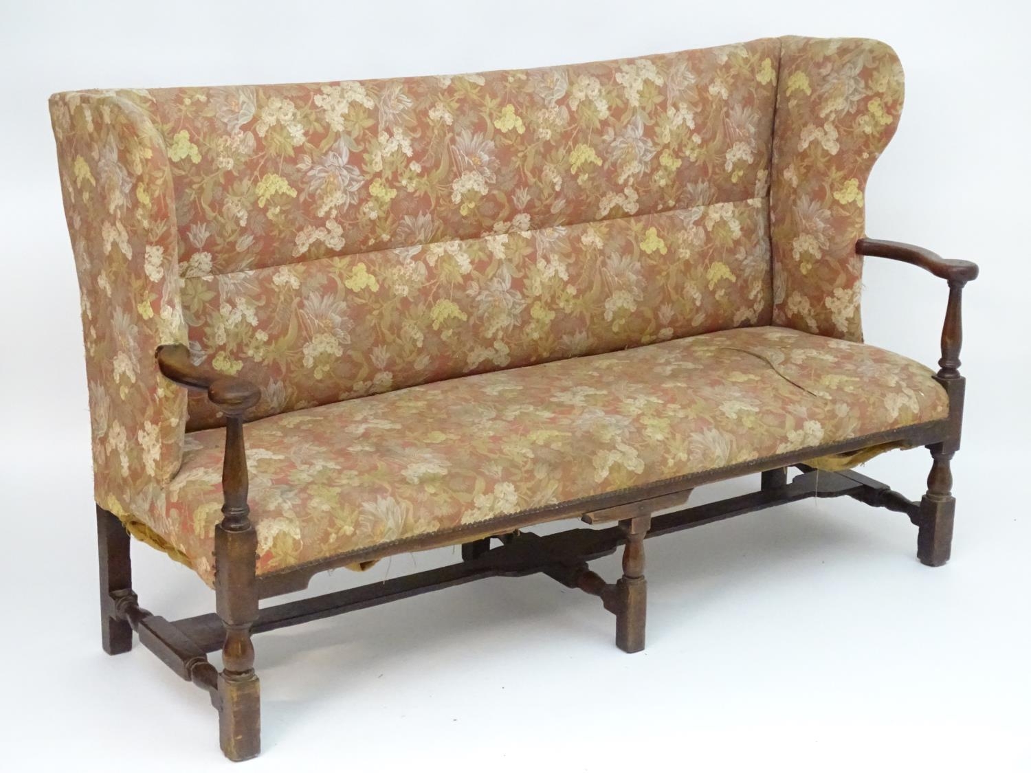 A mid 18thC wingback sofa with scrolled arms and an upholstered backrest and seat above a - Image 2 of 12