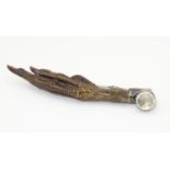 Taxidermy: A white metal brooch with facet cut stone and set with a pheasant foot. Approx. 4 1/4"