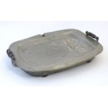 A Victorian pewter plate warmer of oblong form with twin turned wooden handles. Marked London