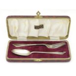 A silver christening set comprising spoon and fork, hallmarked London 1928, maker Robert Pringle &