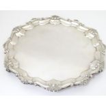 A silver salver hallmarked London 1902, maker Wakely & Wheeler. Approx. 12" diameter Please Note -