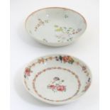 A New Hall style saucer with hand painted floral and foliate detail. Together with another.