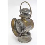 An early 20thC Joseph Lucas No. 72 'King of the Road' oil lamp, standing 12" tall Please Note - we