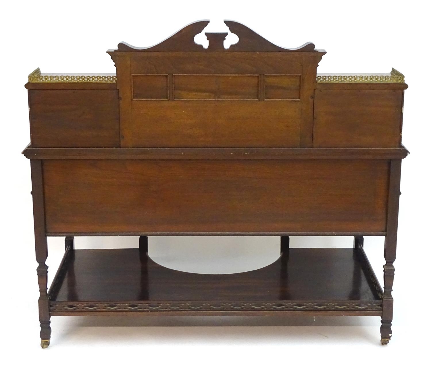 A late 19thC / early 20thC walnut Shoolbred desk with a carved back stand and a pierced brass - Image 2 of 13