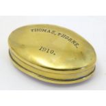 A Welsh early 20th century brass snuff box of oval form the lid engraved Thomas Thorne 1910, stamped