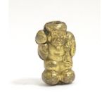 A Japanese brass ojime bead formed as a laughing figure. Approx. 5/8" Please Note - we do not make