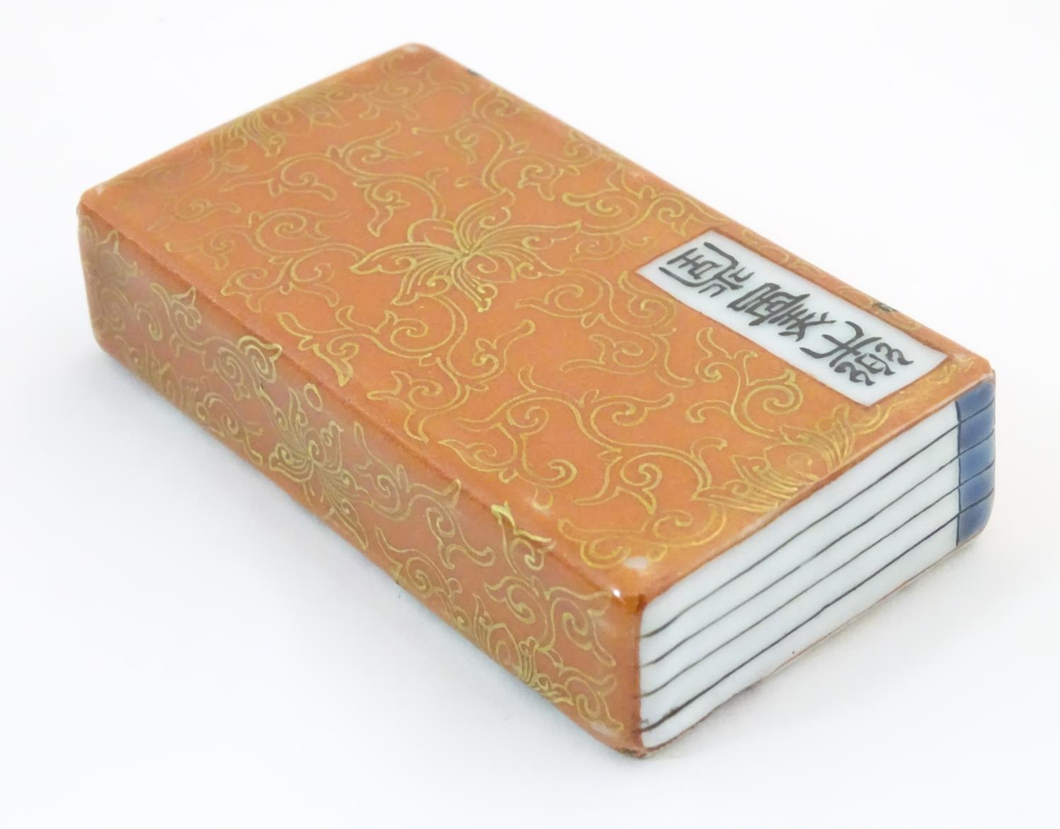 A Chinese porcelain model of a book with scrolling gilt foliate detail and character marks. - Image 3 of 5