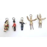 Assorted pendant charms to include traffic policeman, Queen's guard, highland bagpipe player, some