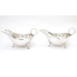 Two silver sauce boats, hallmarked Sheffield 1930 / 31, maker James Dixon & Sons Ltd. Approx. 7"