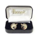 A pair of gilt metal cufflinks set with cabochon containing fly-fishing flies. Approx. 3/4" diameter