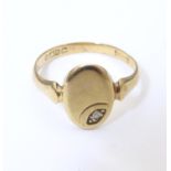 A 9ct gold signet ring set with white stone detail. Ring size approx L Please Note - we do not