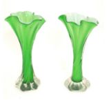 A pair of early to mid 20thC glass handkerchief vases with twist stems, decorated with green and