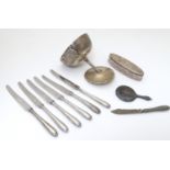 A quantity of assorted silver items to include silver handles tea knives, a silver trophy cup for