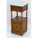 A late 19thC mahogany bedside table with a marble top above a single short drawers and brass