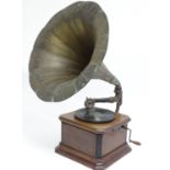 An early 20thC gramophone / phonograph , the clockwork mechanism housed within a mahogany case,