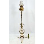 An 1891 Benham & Froud brass and copper tripod standard lamp in the manner of Dr C Dresser.
