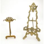 Two 19thC cast brass table top easels, one with floral and foliate detail, the other surmounted by