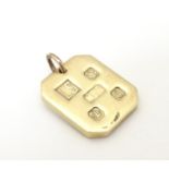 A 9ct gold pendant of ingot form, hallmarked Sheffield, 1977, maker LS. Approx. 1" long Please