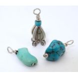 Three various pendants / charms set with turquoise stone detail. Largest approx. 3/4" (3) Please