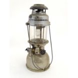 A late 20thC Petromax Rapid hurricane lamp, with chrome finish and swing handle, 16" tall Please