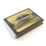 Album: A Japanese postcard album with lacquered boards, the cover depicting a landscape scene with
