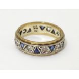 A 9ct gold ring set with sapphires and white stones. Ring size approx O Please Note - we do not make