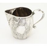 A Continental silver cream jug with import marks for London c. 1905, importer John George