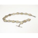 An early 20thC white metal watch chain, linked by fifteen Victorian and Edwardian 3d threepenny