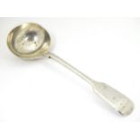 A silver fiddle pattern sauce ladle, hallmarked London 1901, maker Robert Stebbings. 7 1/4" long