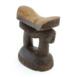Ethnographic / Native / Tribal : A carved African headrest with figural supports. Approx. 8" high