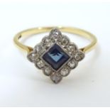 An 18ct gold ring set with central sapphire bordered by diamonds. Ring size approx O 1/2 Please Note