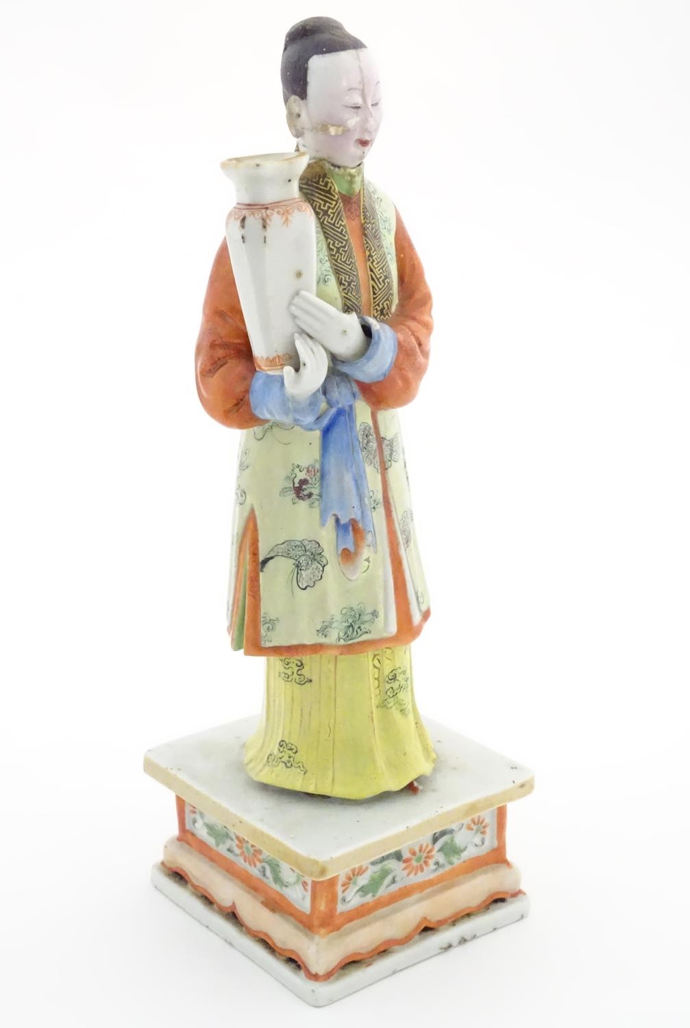 An Oriental porcelain model of a male figure wearing a kimono with butterfly and floral detail - Image 7 of 8