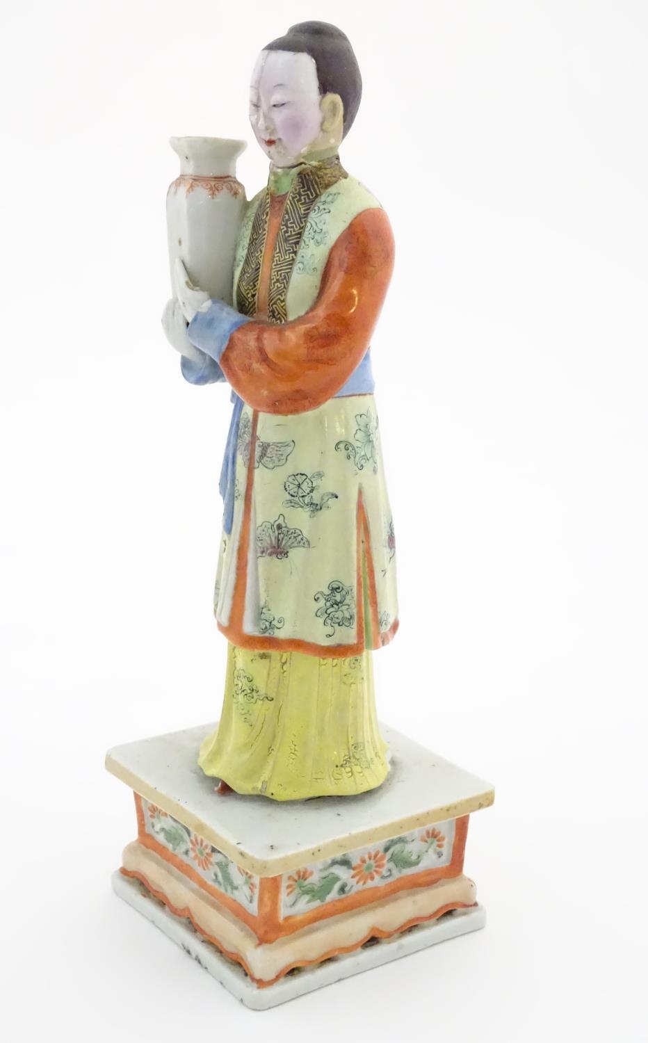 An Oriental porcelain model of a male figure wearing a kimono with butterfly and floral detail - Image 3 of 8