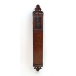 A late 19thC / early 20thC barometer / thermometer case, the long mahogany case with naive folk