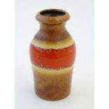 A West German vase with banded detail. Marked under Scheurich 523-18. Approx. 7 1/4" high Please