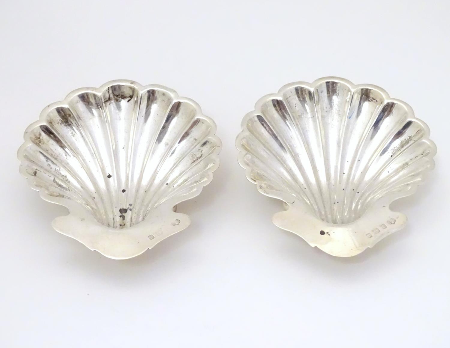 A pair of butter dishes / shells of scallop shell form. Hallmarked Birmingham 1906 maker Elkington &