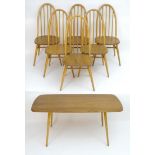 A vintage retro Ercol dining table and set of six chairs, the figured elm table having rounded edges