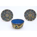 Three Chinese cloisonne items comprising a bowl decorated with dragons amongst stylised clouds,